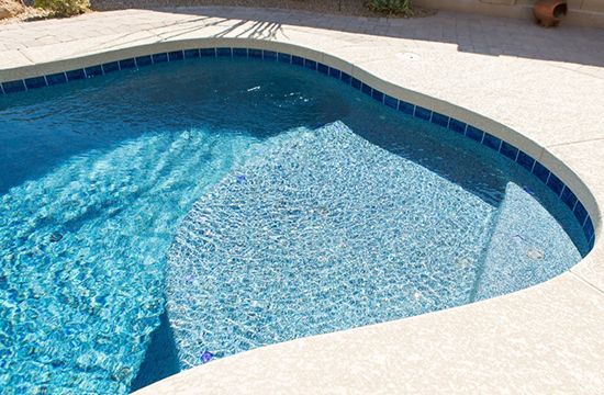 Pebble Tec pool interior finish showing blue water color and texture